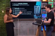 Mulher e homem em estúdio. Ela aponta para tela sobre Fundos Imobiliários; ele usa notebook. Cenário de transmissão.