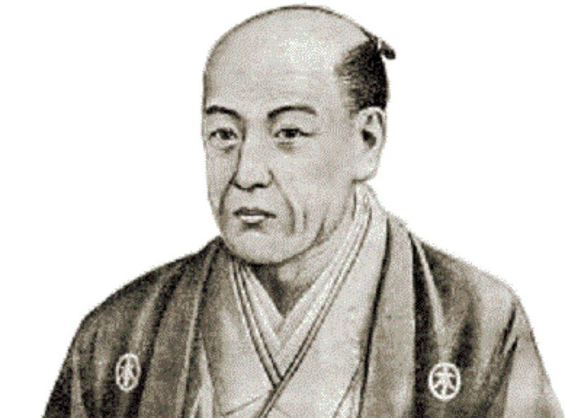 Retrato de um homem japonês tradicional com quimono e penteado chonmage.