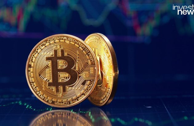 Duas moedas Bitcoin douradas sobre um fundo escuro com gráfico financeiro.