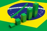 Gráfico de barras verdes e seta ascendente sobre a bandeira do Brasil, simbolizando crescimento.