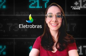 Apresentadora sorrindo em fundo digital com dados financeiros e logotipos Eletrobras e Invest News.