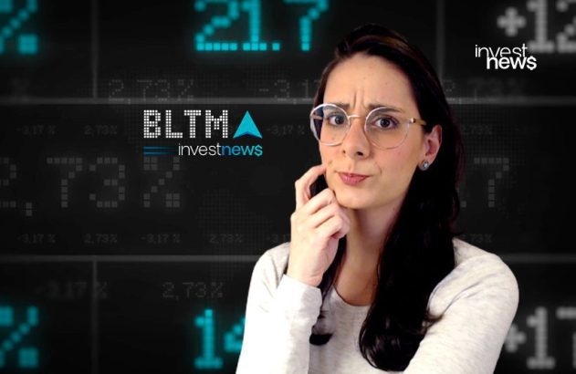 Mulher com óculos, expressão de dúvida, diante de tela digital exibindo dados do mercado financeiro e logos "investnews".