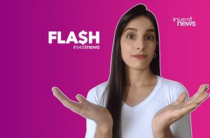 Mulher com expressão surpresa e mãos abertas em fundo roxo e rosa com logos 'FLASH' e 'investnews'.