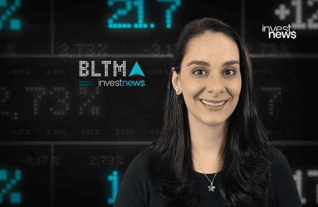 Apresentadora sorrindo em frente a tela de dados financeiros. Logos: Investnews e BLTMA.