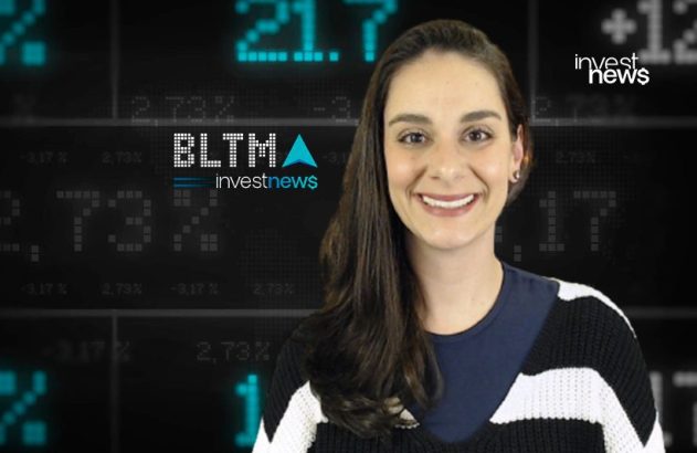 Mulher sorrindo em frente a um painel com dados financeiros e o logo "investnews".