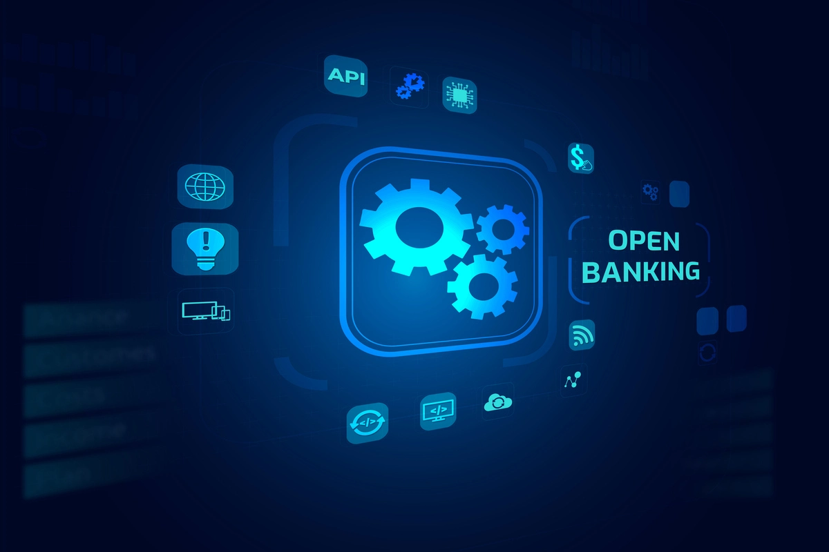 A imagem mostra três engrenagens, uma com a outra, e ao lado está escrito open banking.