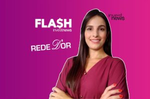 Apresentadora do Investnews sorrindo, com textos "FLASH $" e "REDE D'OR" em fundo roxo e rosa.