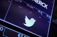 Tela exibindo cotações de ações da Twitter (com logo) e Merck.