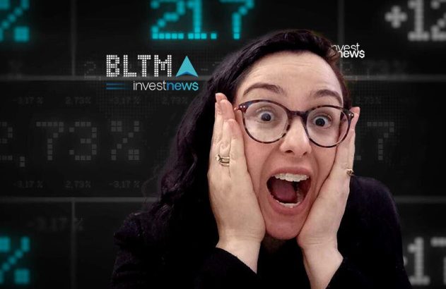 Mulher de óculos em choque, mãos no rosto, diante de tela com dados financeiros e "investnews".