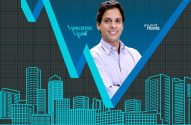 Homem sorrindo, com gráfico financeiro em V e prédios ao fundo. Logos: 'Analistas em Ação' e 'Invest News'.