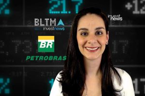 Mulher sorridente com fundo de tela de dados financeiros e logos investnews, BR e PETROBRAS.