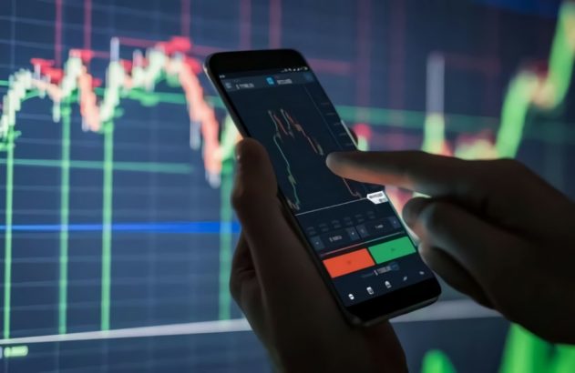 Ilustração de um mão com o celular verificando gráficos do Ibovespa mercado financeiro