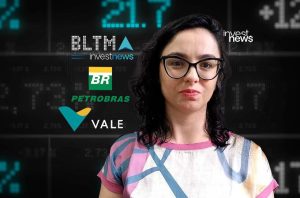 Mulher em frente a tela digital com dados financeiros e logos (Petrobras, Vale, Investnews).