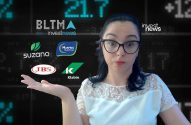 Mulher surpresa gesticula, em frente a logos de empresas (JBS, Suzano) e painel financeiro ao fundo.
