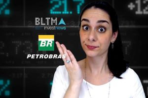 Mulher surpresa gesticula em frente a tela com logos Petrobras, BR e dados financeiros de ações.