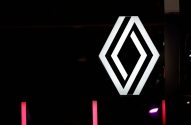 Logotipo da Renault, em formato de losango vazado, iluminado em branco e preto sobre fundo escuro. Barras de luz rosa.