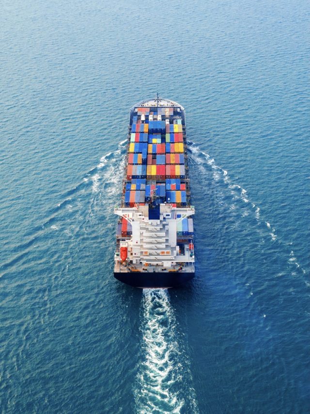 Aerial view of container cargo ship in sea.