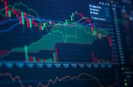 A imagem mostra um monitor exibindo um gráfico de candlestick. (Foto: Shutterstock / Xalien)