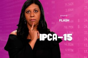Mulher pensativa com dedo no queixo em fundo financeiro rosa, com texto "IPCA-15".