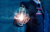 Pessoa de terno segura projeção digital luminosa de edifícios urbanos na mão.