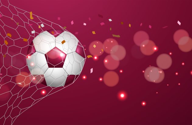 Bola de futebol branca e vinho acaba de marcar gol na rede, com confetes e luzes vibrantes no fundo.