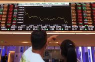 painel de cotações da B3 mostrando índice IBOVESPA e outras ações
