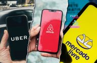Três celulares exibindo os logos dos aplicativos Uber, Airbnb e Mercado Livre.