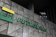 Logos da Petrobras (BR e PETROBRAS) em fachada de prédio.