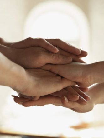 Close up of caucasian male and female hands, covering one another, team, friendship, business