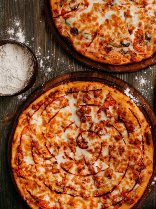 front-view-pizza-with-cheese-wooden-rustic-floor