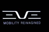 Logotipo estilizado 'EVE' e texto 'MOBILITY REIMAGINED' em branco sobre fundo preto.