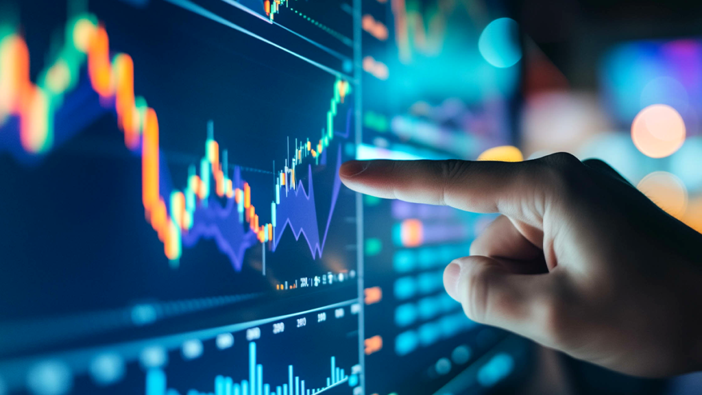Mão apontando para gráficos de mercado financeiro em uma tela digital.