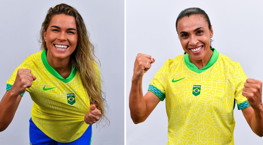 Duas mulheres em camisa amarela do Brasil, sorrindo e comemorando com punhos cerrados.