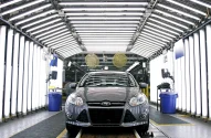 A Ford Focus goes through quality inspection on the assembly line at Ford Motor Co.'s Michigan Assembly Plant December 14, 2011 in Wayne, Michigan. Ford released details about the electrification of the Michigan Assembly Plant that will power production in part by one of the largest solar energy generator systems in order to produce their new C-MAX Hybrid and C-MAX Energi electric vehicles. (Photo: Bill Pugliano/Getty Images)
