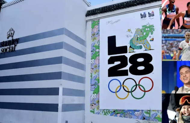 Fachada de prédio com letreiro 'Stanley Social' e mural LA28 com logotipos olímpicos e fotos de atletas.