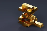 Pilha de barras de ouro em fundo cinza; valorização do ouro