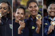 Quatro atletas brasileiras sorrindo com suas medalhas de ouro. Uma beija a medalha, as outras as exibem.