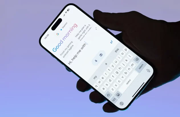 Smartphone exibindo interface de assistente virtual com solicitações e mensagem "Good morning", sob fundo azul e lilás.