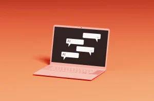 Um laptop rosa claro em um fundo alaranjado exibe balões de conversa na tela, sugerindo interações digitais e inteligência artificial.