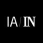 Logo com letras brancas 'IA / IN' em fundo preto. 'IA' sem serifa, 'IN' com serifa.