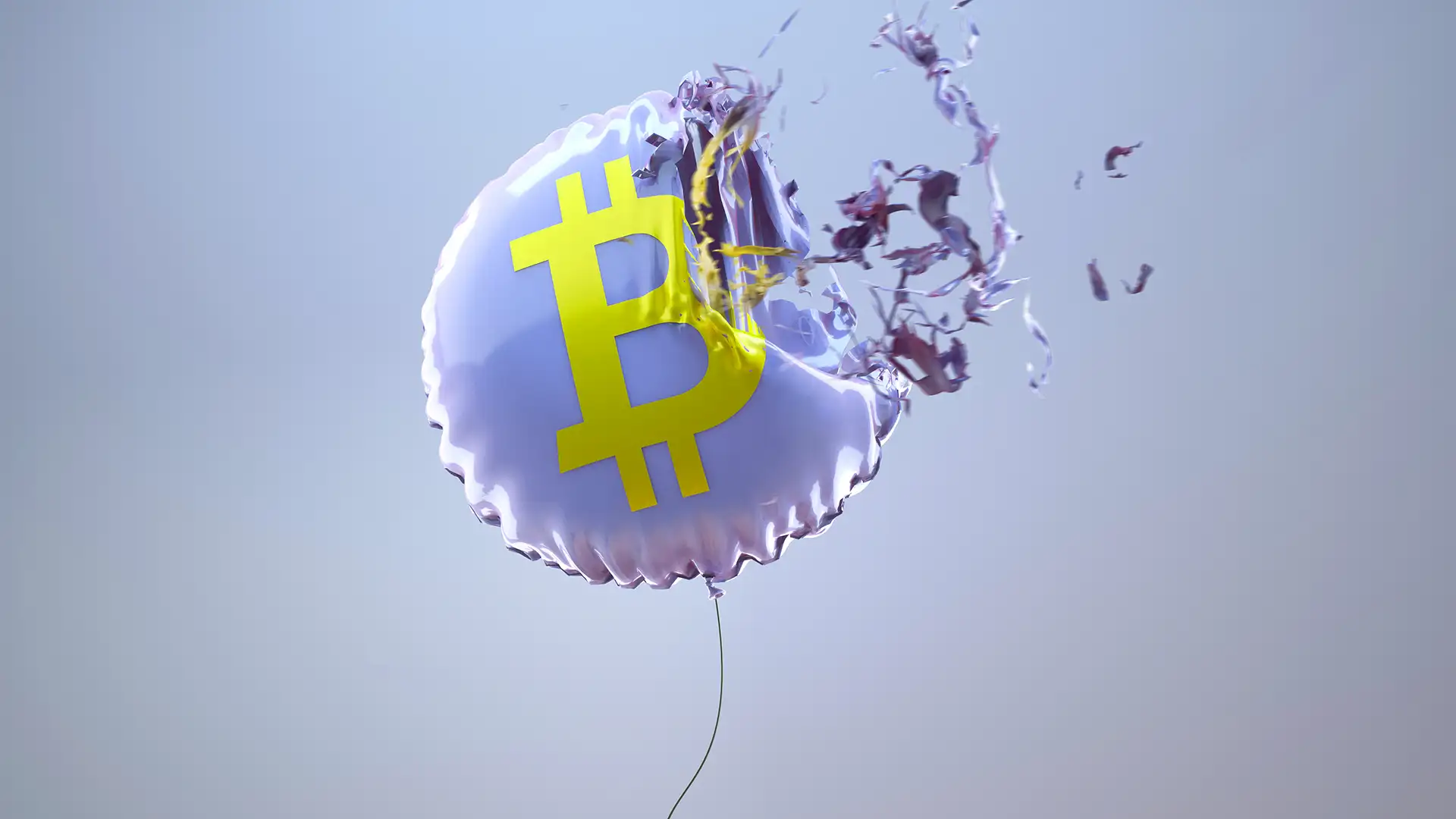 Imagem de balão metálico prateado com símbolo de Bitcoin amarelo no centro, prestes a explodir. Fragmentos são projetados para fora contra um fundo azul-claro.
