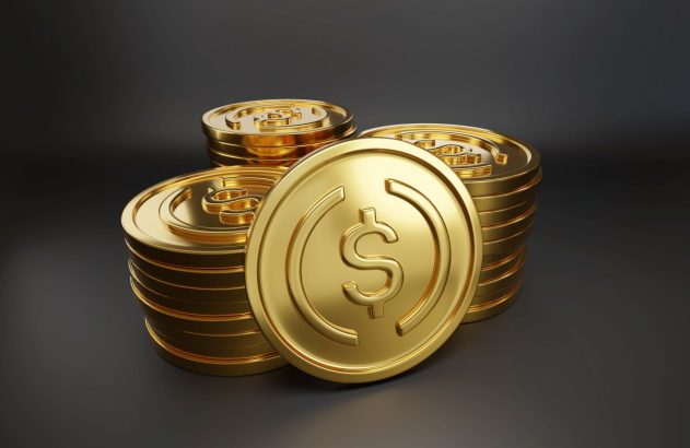 Stablecoins amontoadas, em formato de moedas de ouro