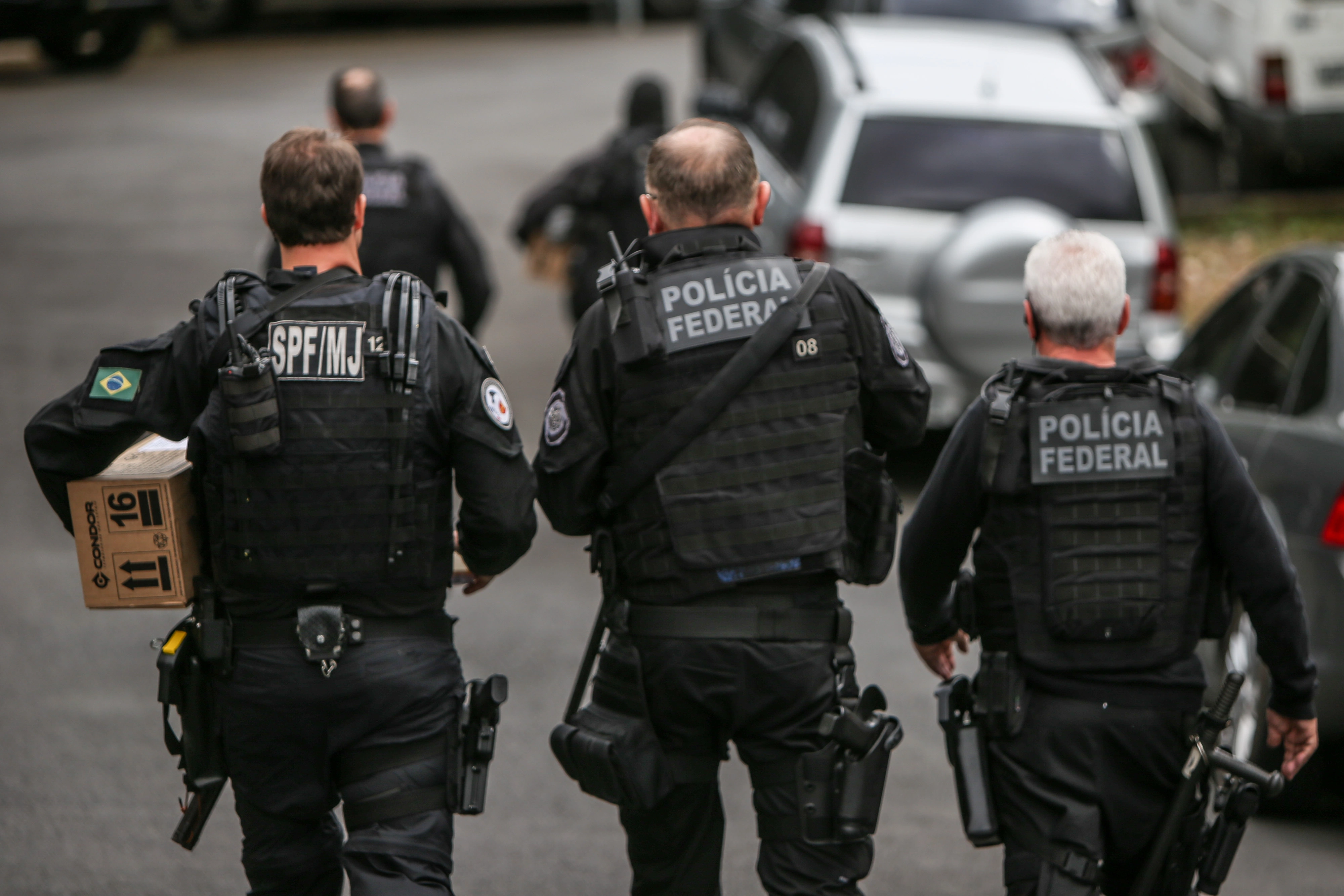 a group of police officers walking down a street
