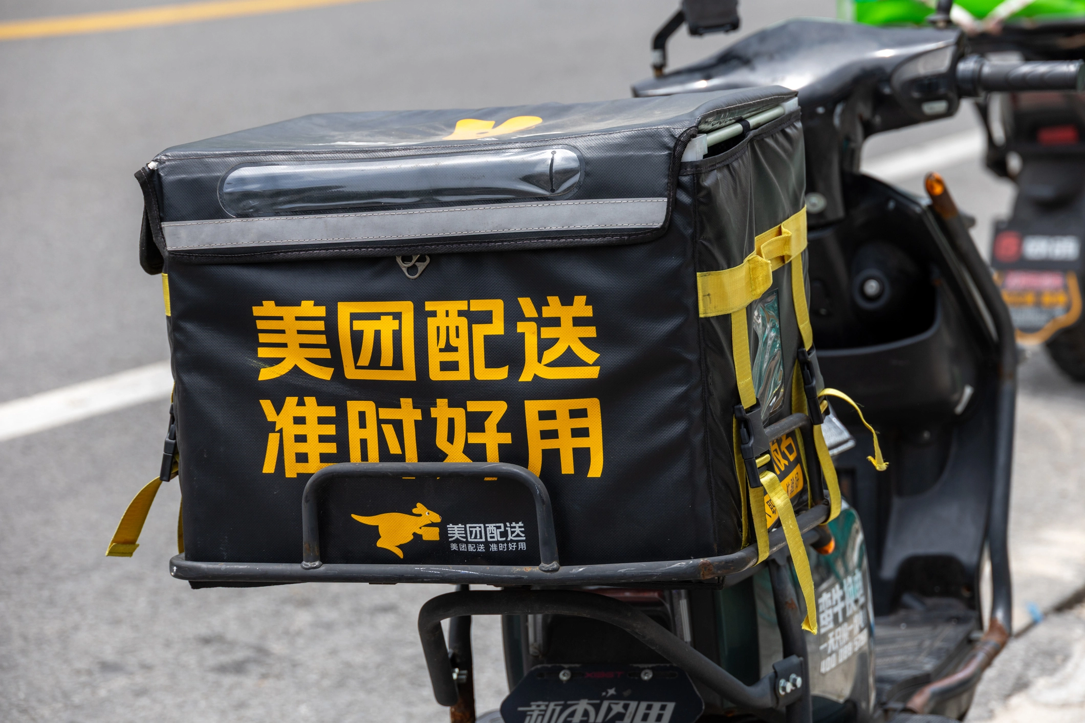 a black and yellow bag on a motorcycle