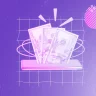 Imagem mostra o dólar e remete ao tema de viagens. Dólar mais favorável favorece viagens ao exterior