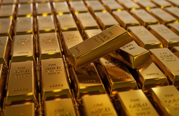 Barras de ouro enfileiradas e duas em cima delas
