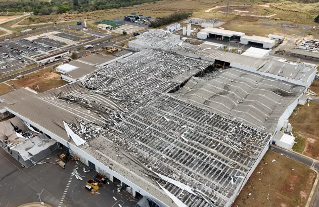 a large building with a damaged roof