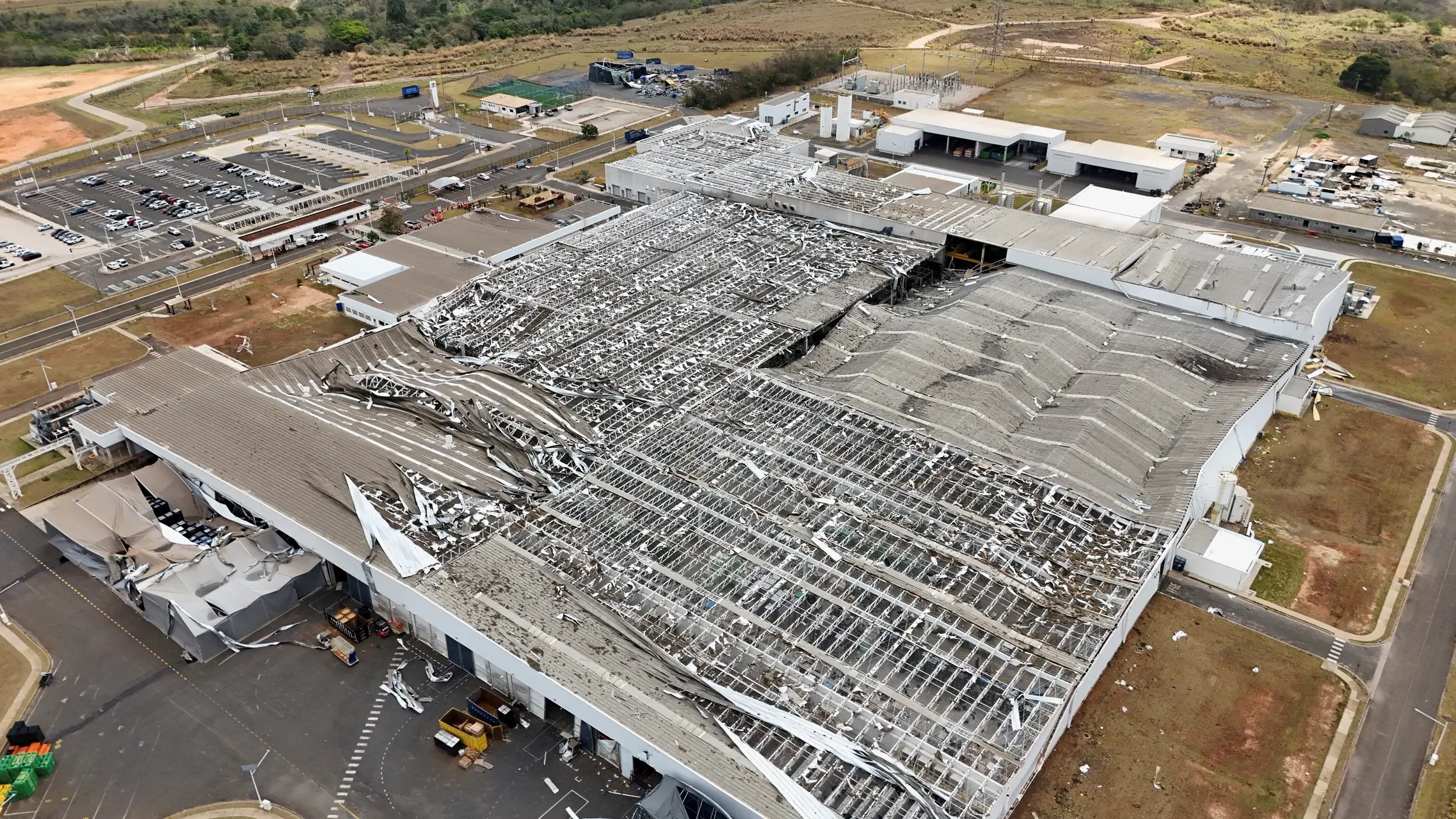 a large building with a damaged roof