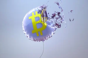 Imagem de balão metálico prateado com símbolo de Bitcoin amarelo no centro, prestes a explodir. Fragmentos são projetados para fora contra um fundo azul-claro. Imagem para ilustrar conteúdo sobre o sinal técnico cruz da morte