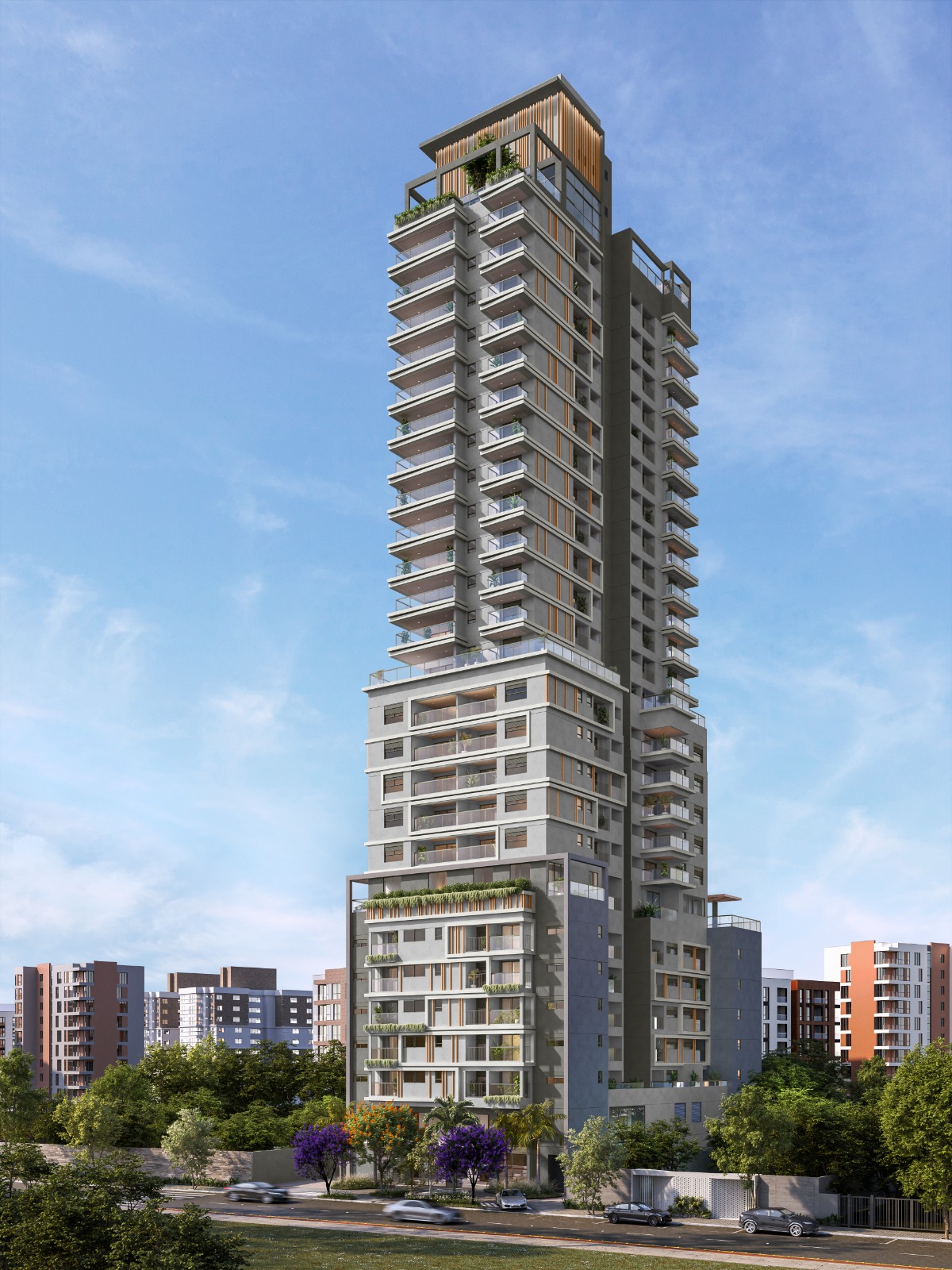 Edifício residencial alto, com fachada em tons de cinza, varandas amplas com vidro e áreas verdes distribuídas nos andares. O prédio fica em área urbana, cercado por outros edifícios e arborização.